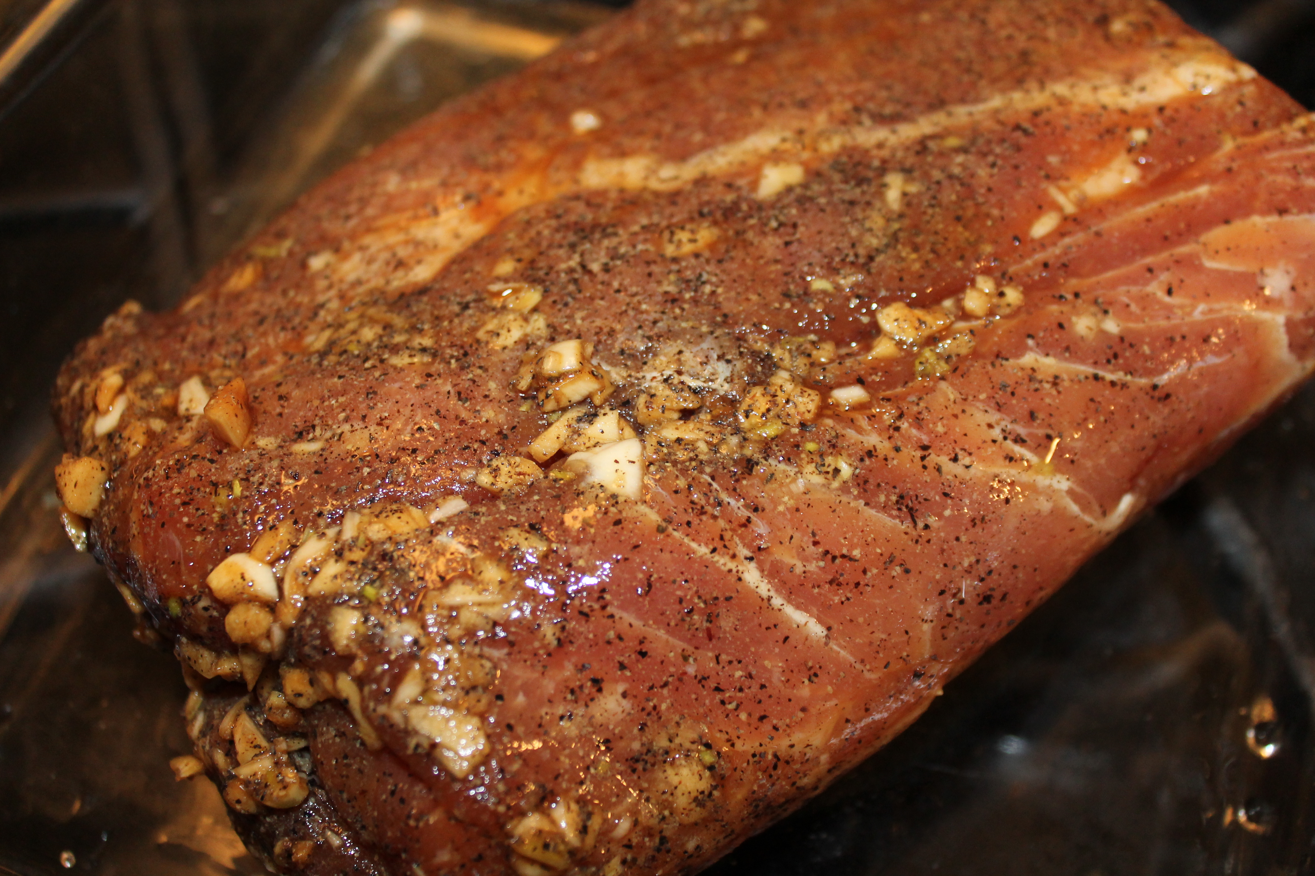 A pork loin, trimmed, seasoned, and ready to crust